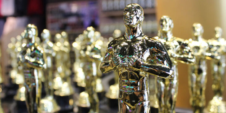 Golden Award statues of men - national recycling awards healthcare waste